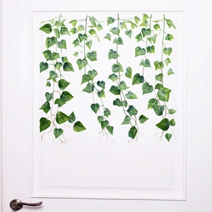 Macro detail of cascading green vine wall stickers with watercolor leaf textures
