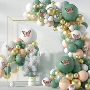 Detail of sage green balloon arch with 3D gold butterflies on rectangular frame