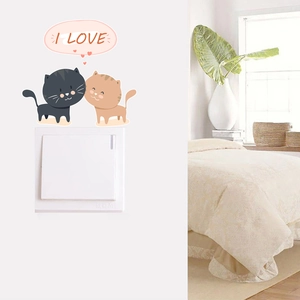 Cartoon cat switch wall decal with black and orange kittens and pink heart heart