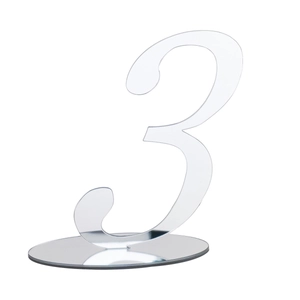 Macro shot of silver mirror acrylic table number 3 with a round stand for wedding events