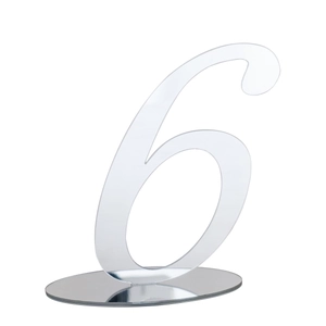 Close-up of transparent acrylic wedding table number 6 with reflective circular base