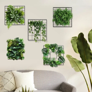 Modern wall decor featuring five black metal grids with realistic artificial green plants