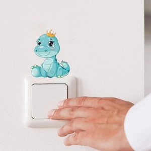 Cute baby dinosaur wall sticker with yellow crown on a white light switch decor