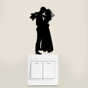 Detail of romantic silhouette wedding switch sticker featuring a bride and groom embracing