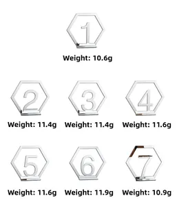 Set of 7 silver acrylic hexagon table numbers with mirrored finish and metal base