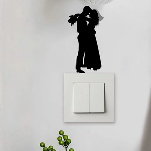 Romantic wedding silhouette light switch wall sticker featuring a couple embracing