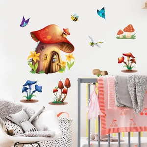 Detail of cartoon mushroom house wall stickers set in a cozy white nursery room