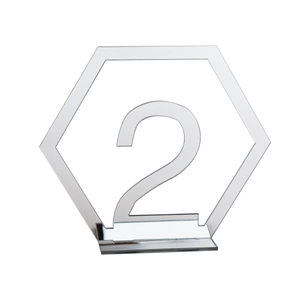 Macro detail of silver acrylic hexagon table number 2 with mirror finish for weddings