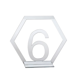 Macro shot of hexagonal silver acrylic mirror table number 6 with stable base