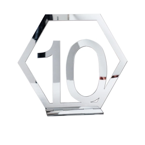 Close-up of hexagonal silver acrylic mirror table number 10 with stand for weddings