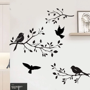 Minimalist black silhouette wall decals featuring birds and leafy branches for home decor
