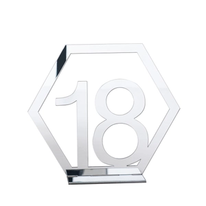 Close-up of hexagonal silver acrylic table number 18 with mirror finish and stable base