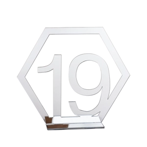 Macro view of silver mirror acrylic hexagonal table number 19 with stable base