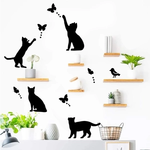 Black cat silhouettes and butterfly wall stickers for a modern living room decor