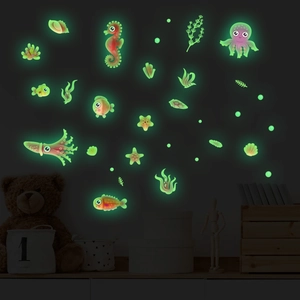Glow-in-the-dark marine wall stickers featuring octopus and seahorse in a dark bedroom