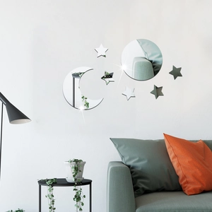 Detail of moon and star acrylic mirror wall stickers on a modern living room white wall