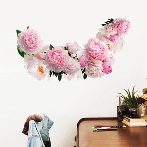 Pink peony wall stickers displayed above a desk creating a cozy home aesthetic scenery