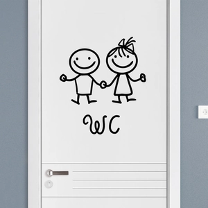 Détail de l'autocollant noir de couple de dessins animés avec texte WC sur porte blanche