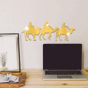 Detail of gold mirror acrylic camel wall stickers reflecting a cozy living room scene