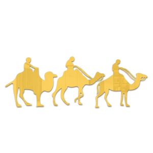 Macro shot of three golden mirror acrylic camel caravan wall stickers with metallic texture