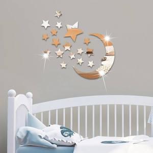 Silver acrylic mirror wall stickers with moon and stars above a white nursery crib