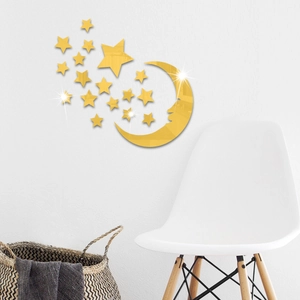Detailed view of gold acrylic mirror moon and stars wall stickers in a modern bedroom