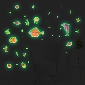 Luminous marine life wall decals set featuring glowing dolphins and corals in the dark