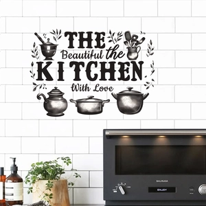 Close-up of black PVC kitchen wall sticker with decorative cookware and artistic lettering