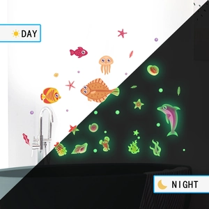 Glow in the dark ocean themed wall stickers showing day and night fluorescent effect