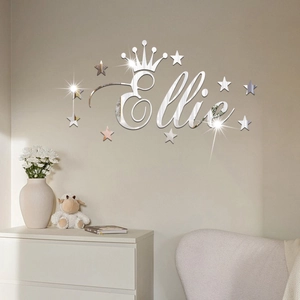 Detail view of silver acrylic mirror wall stickers featuring Ellie name with stars