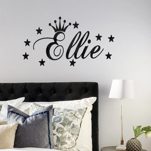 Custom black acrylic wall sticker with name Ellie crown and stars in a modern bedroom
