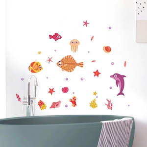 Detailed view of luminous ocean wall stickers with cartoon fish on a bathroom wall