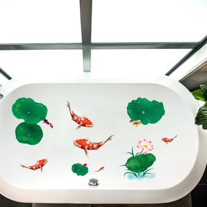 Chinese style lotus and koi fish wall stickers applied to a modern white bathtub