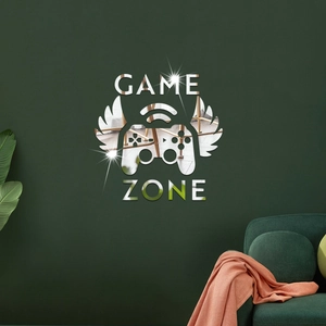 Silver mirror acrylic Game Zone wall decal with controller wings on a dark green wall