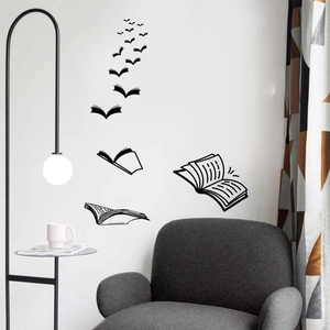 Detail of creative black vinyl wall decal showing books transforming into flying birds