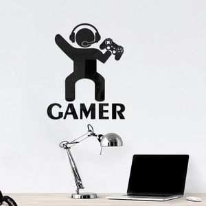 Macro shot of 3D mirror acrylic gamer silhouette wall sticker with headset and controller