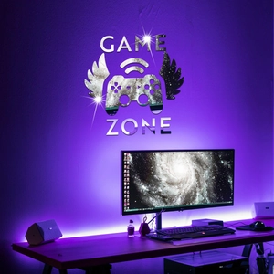 Silver mirror acrylic Game Zone wall sticker with controller wings over a gaming setup