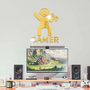 Detail of golden mirror acrylic gamer silhouette wall sticker showing metallic finish