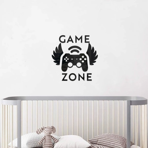 Close-up of black acrylic game zone wall sticker with wings and controller icons