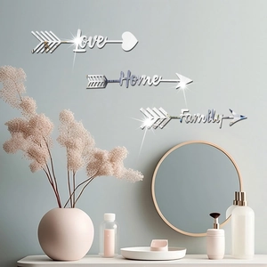 Detail view of mirror acrylic wall stickers with Love Home Family arrow designs