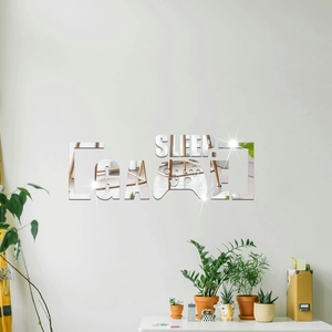 Detail of 3D acrylic mirror wall stickers with SLEEP and GAME game controller design
