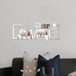 Detail showing mirror effect acrylic wall stickers with SLEEP GAME text and gamepad design