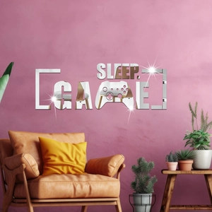 Close-up of silver acrylic mirror wall stickers featuring Sleep Game text and a gamepad
