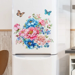 Detailed view of colorful floral butterfly decals on a white modern refrigerator