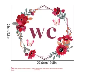 Detail of red floral wreath toilet sticker with WC text and pink butterfly accents