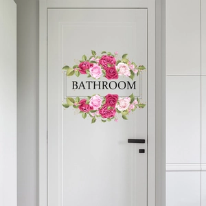 Elegant pink rose floral bathroom door wall sticker with black lettering on white door