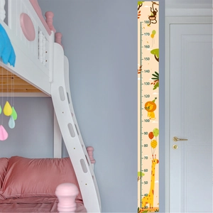 Detailed scale of cartoon giraffe height wall sticker measuring 30cm to 180cm on blue wall