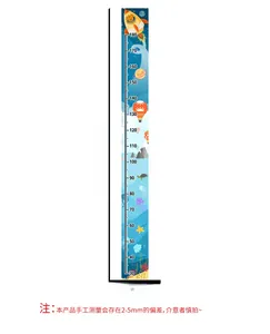 Vertical detail of kids height wall sticker with rocket, planet and sea creature motifs