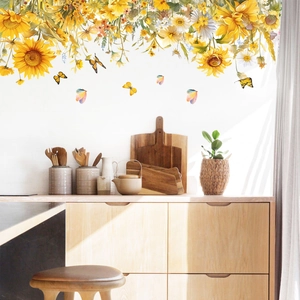 Detail showing self-adhesive sunflower and butterfly wall stickers in a bright kitchen