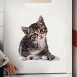 3D realistic tabby kitten wall sticker applied to a white bathroom surface with 3D shadow